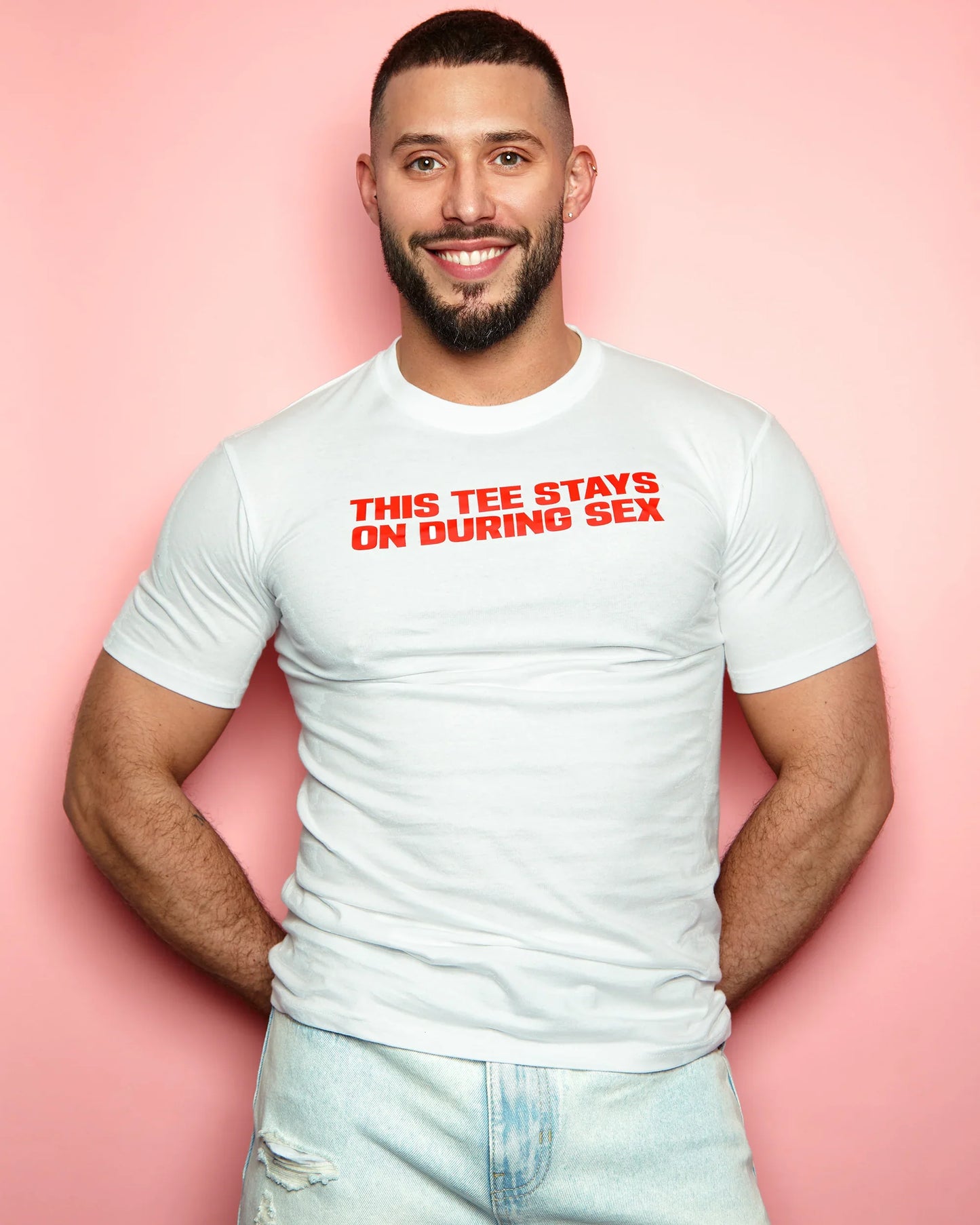 Slogan tee: This t-shirt stays on, red print on white t-shirt