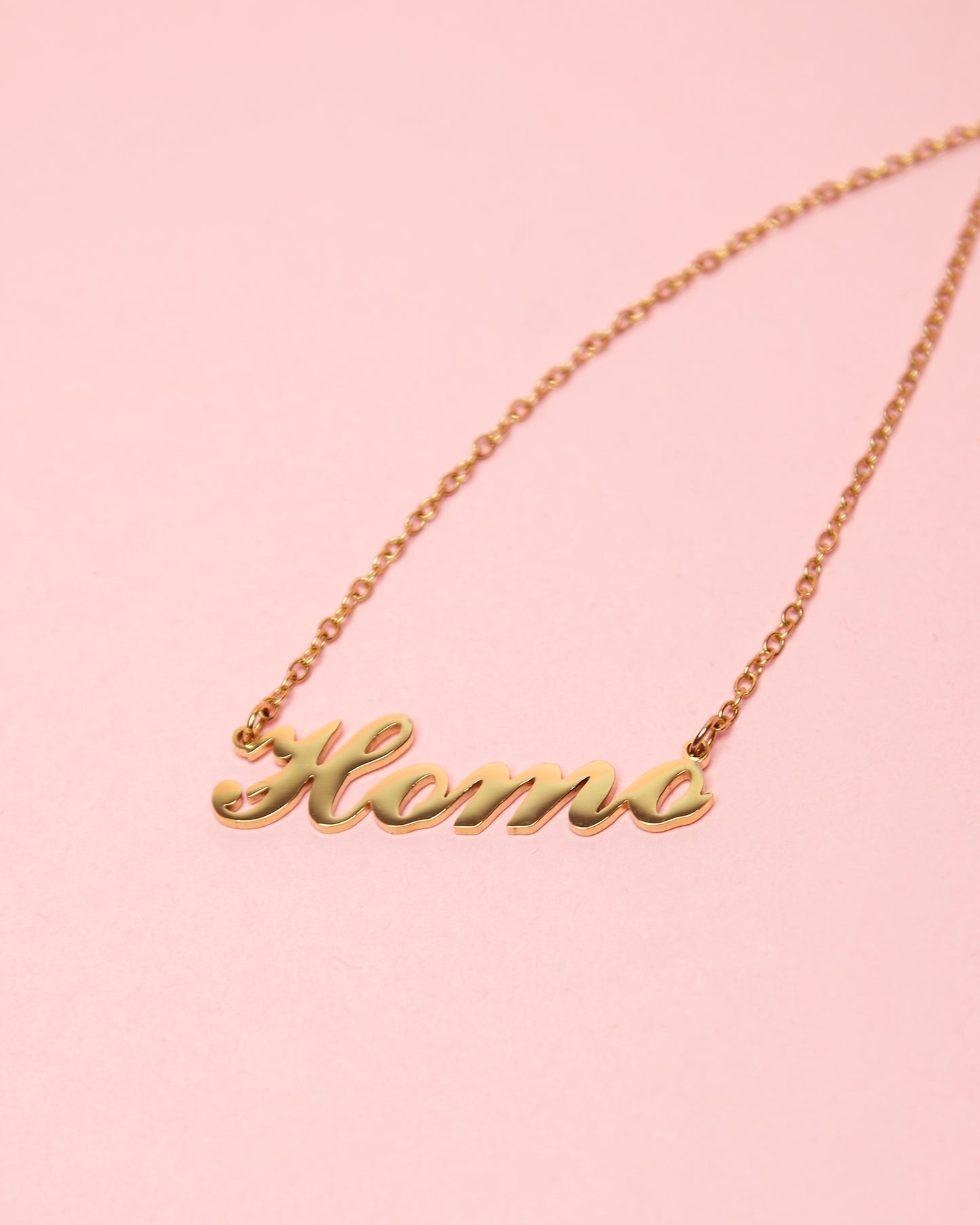 HOMO calligraphy gold plated, stainless steel necklace