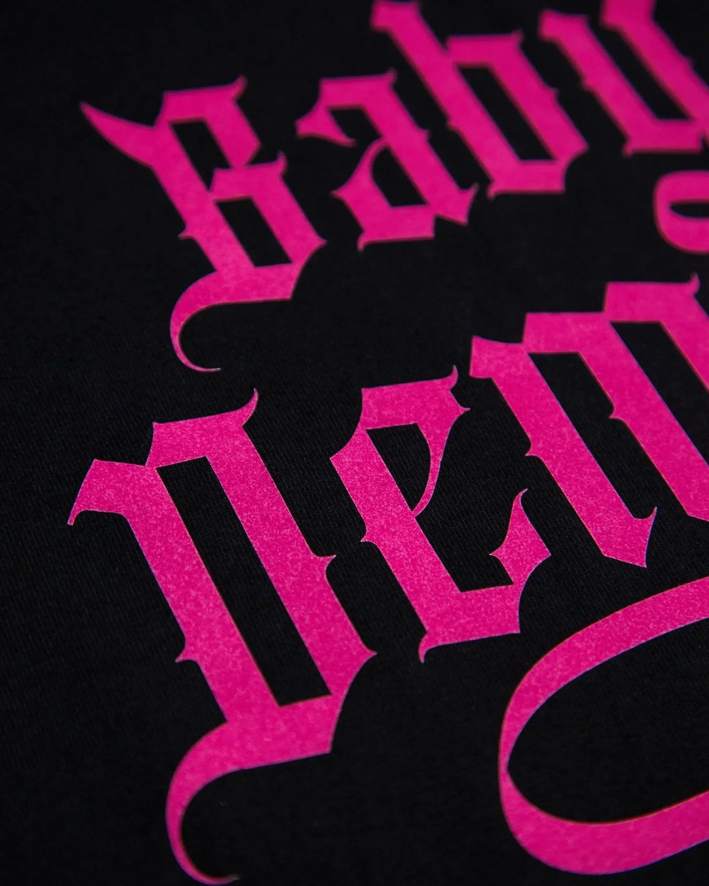 Baby Demon, pink flock on on black tshirt