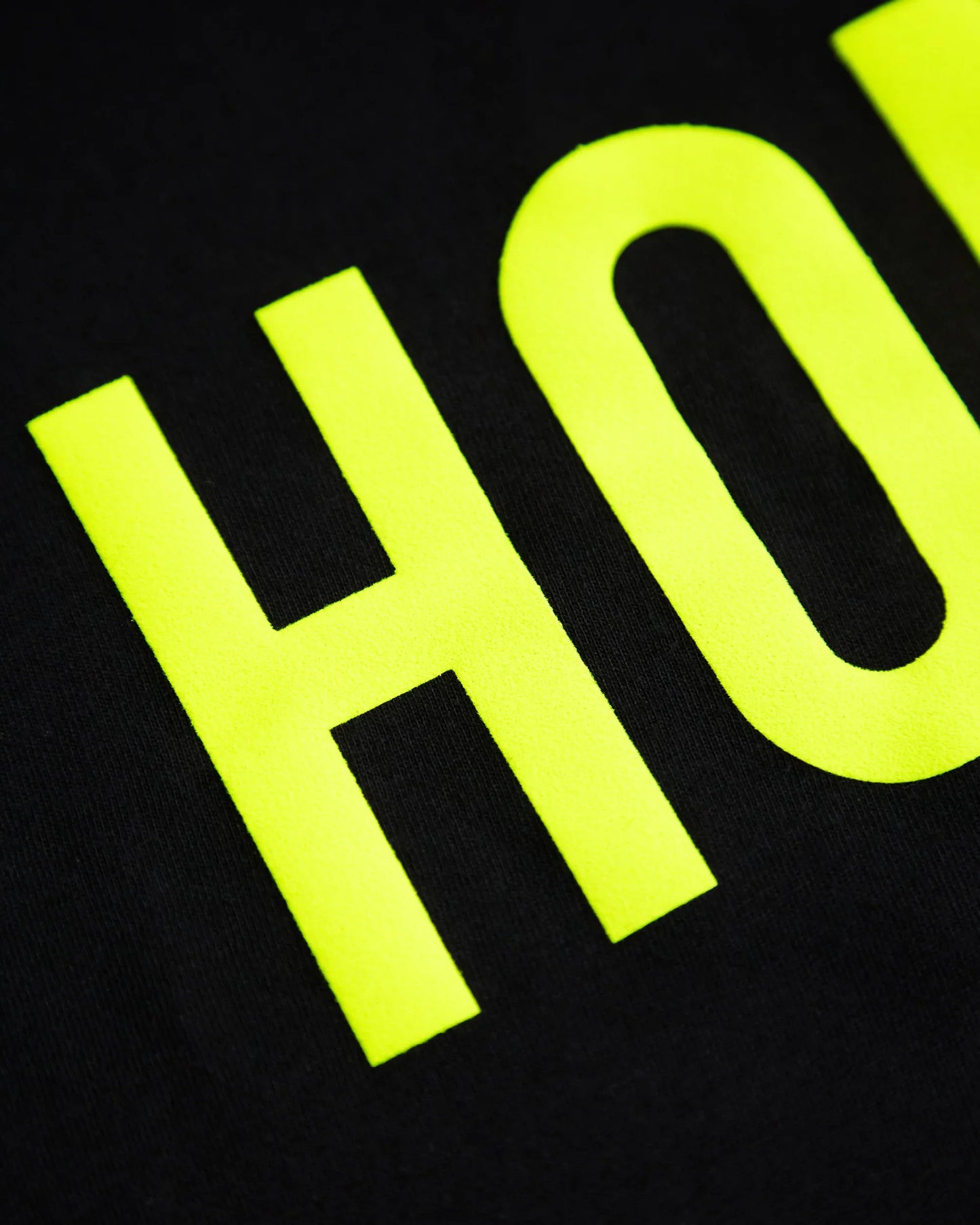 HOMO Logo, fluorescent yellow flock on black tshirt