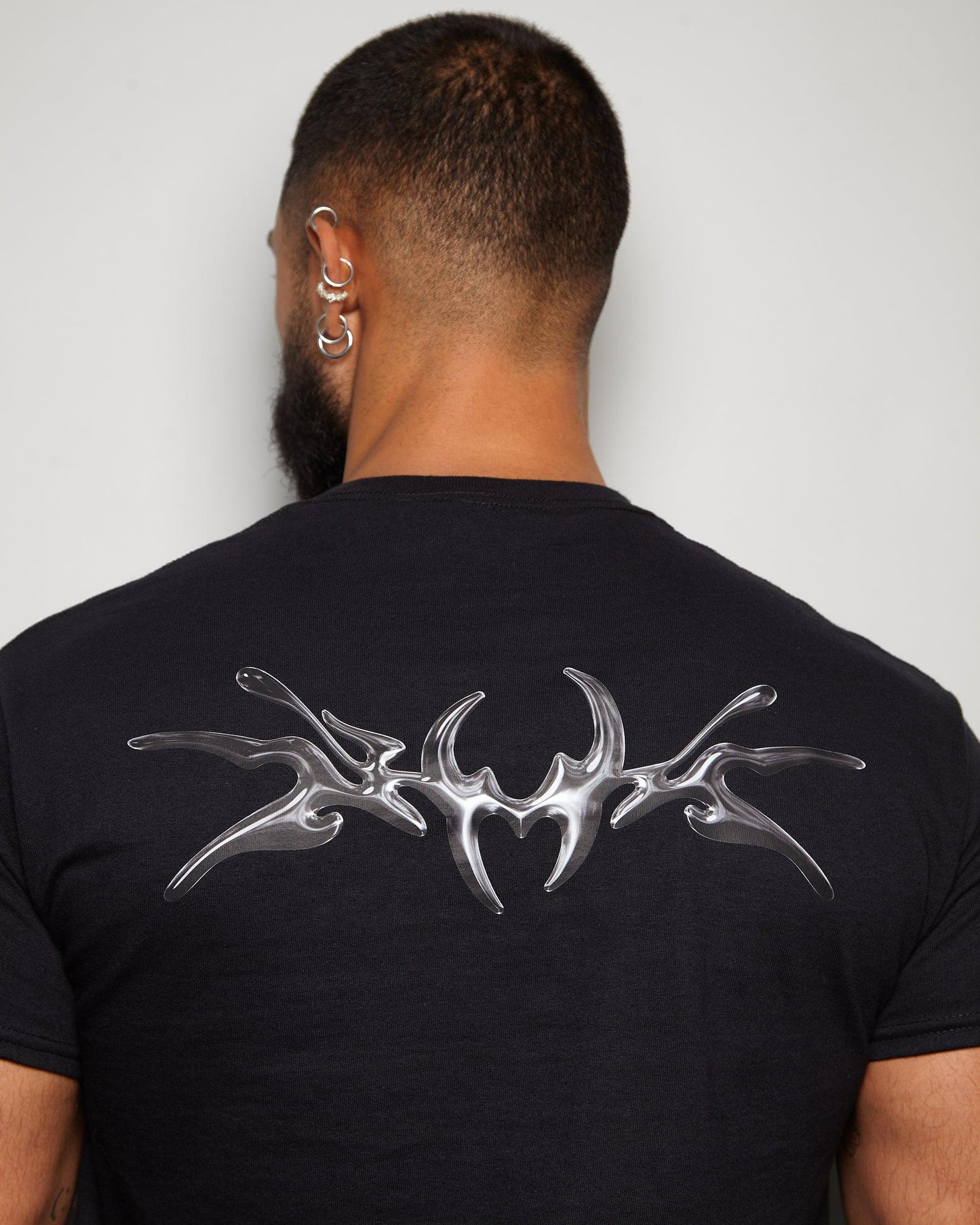 NXS002: Gunmetal style print on black tshirt