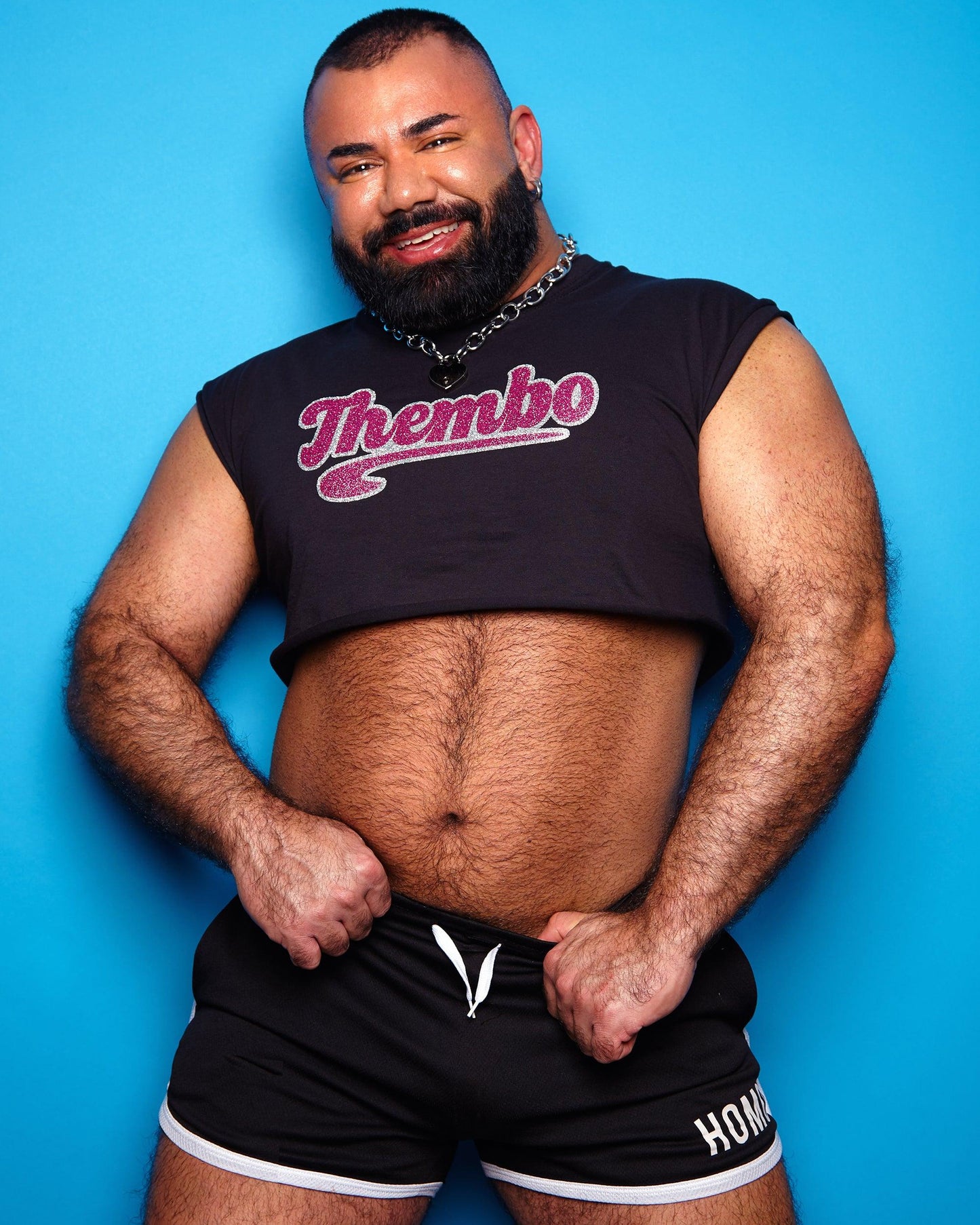 Thembo, pink/silver glitter on black - Sleeveless crop-top.