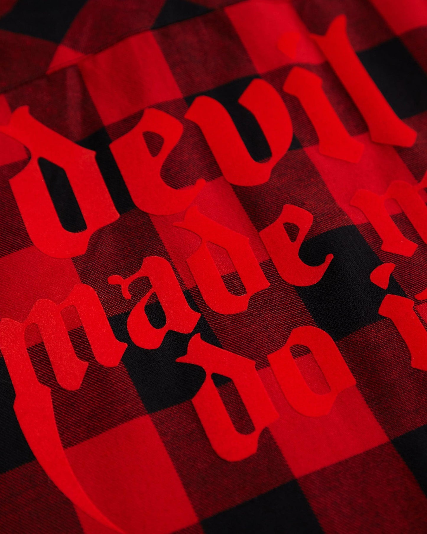 Devil made me do it, red flock on sleeveless checked flannel shirt