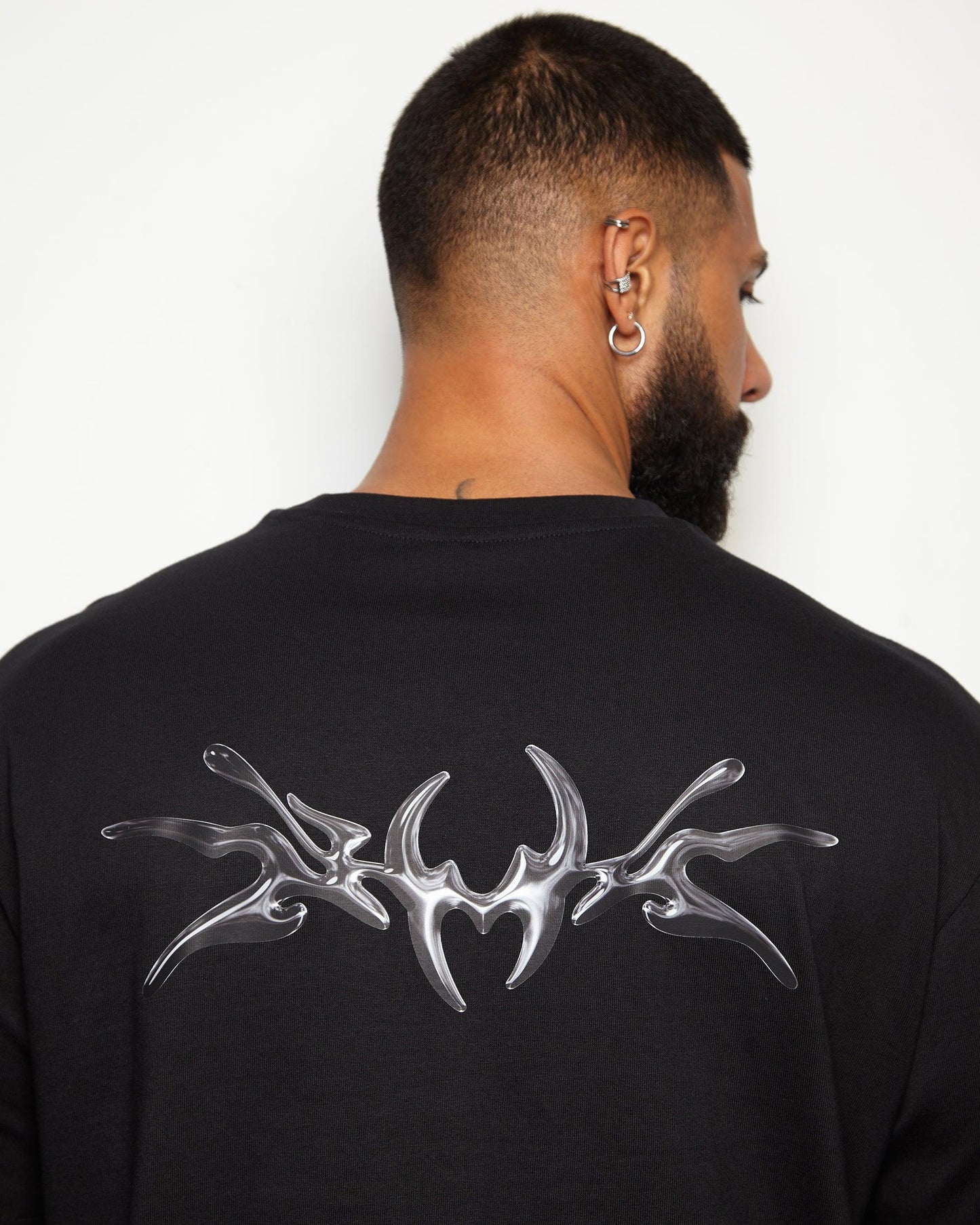 NXS001: Gunmetal style print on black heavy weight oversized tee.