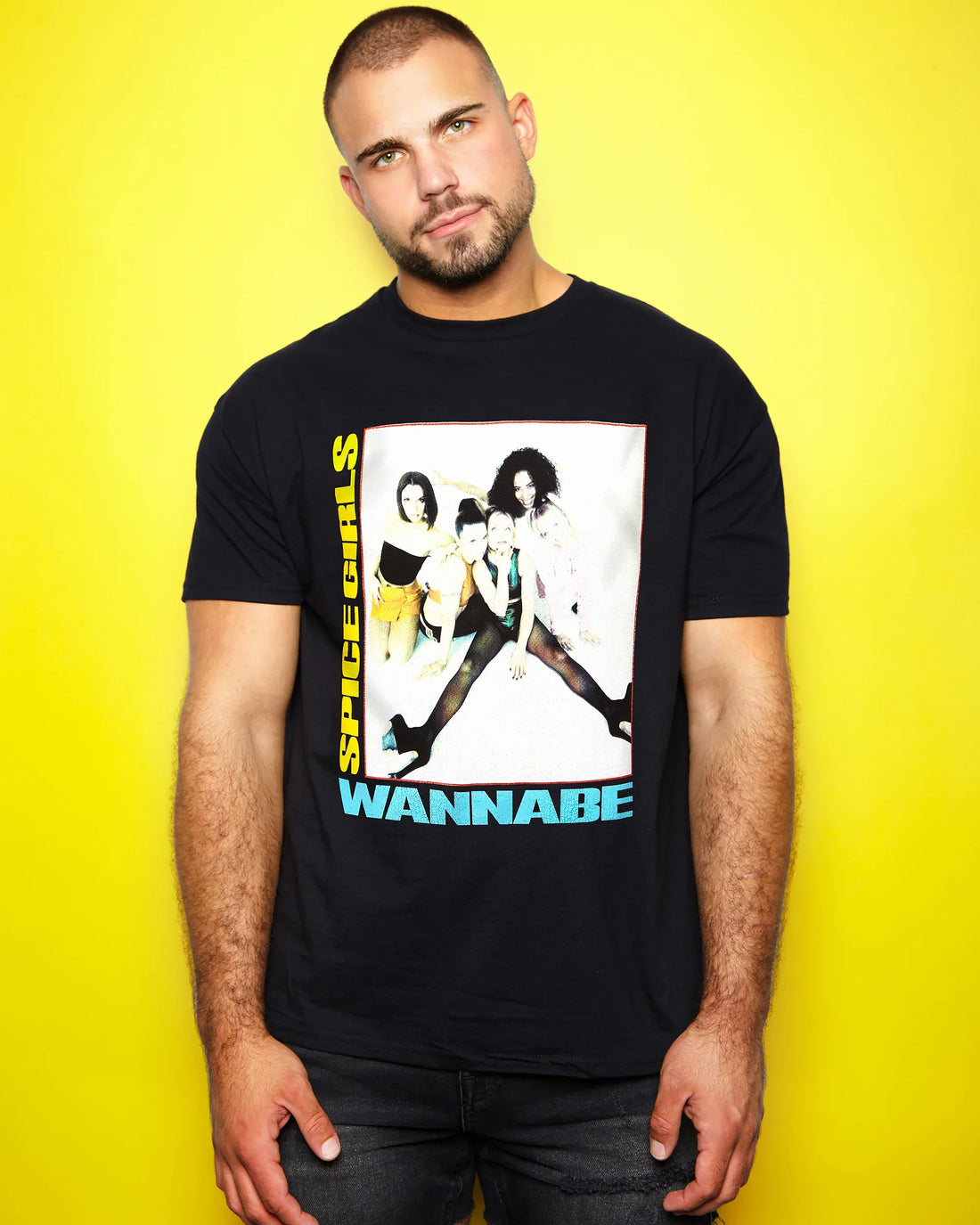 Man wearing a black t-shirt with a The Spice Girls Wannabe design on a yellow background