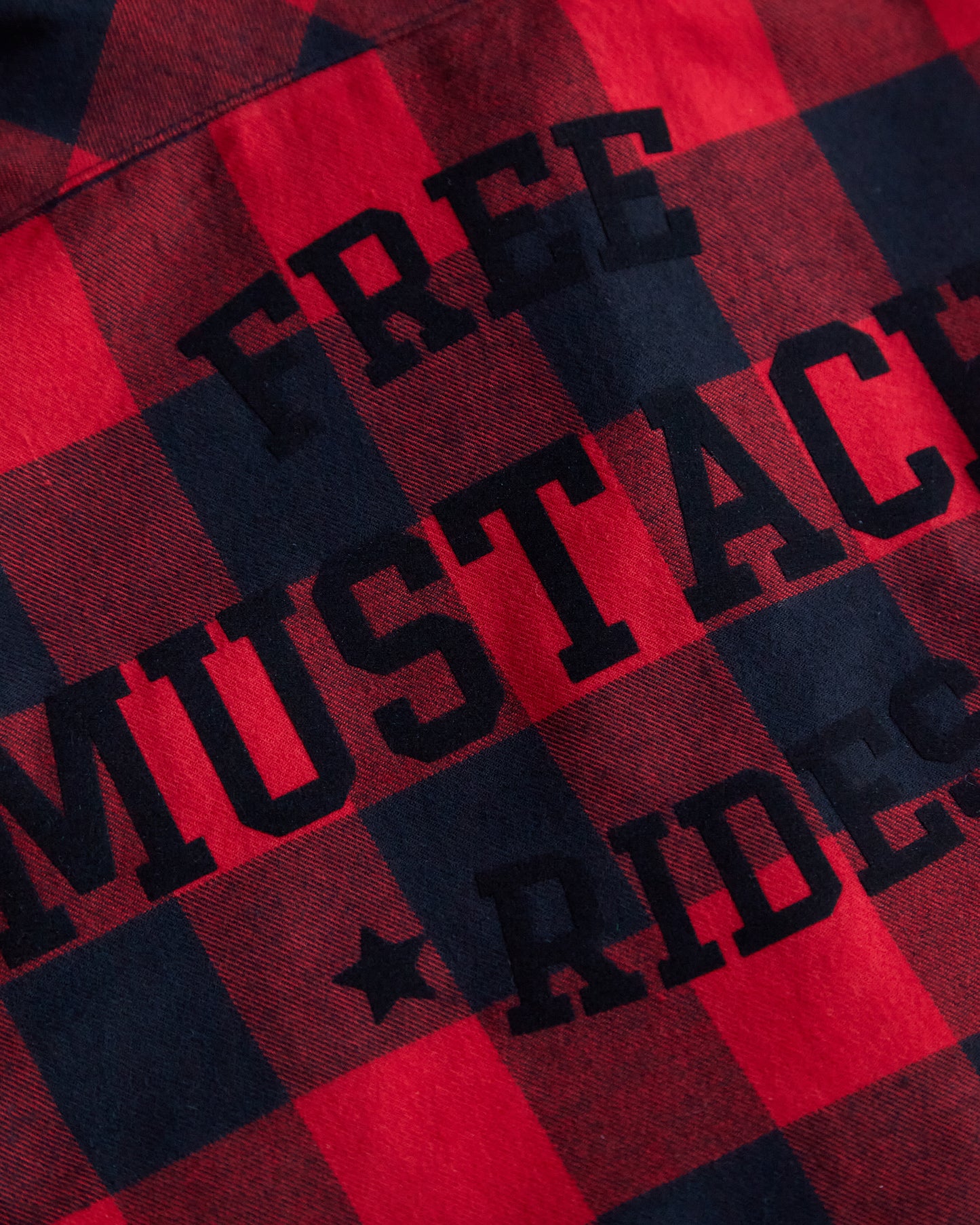 Free mustache rides, black flock on sleeveless checkered shirt
