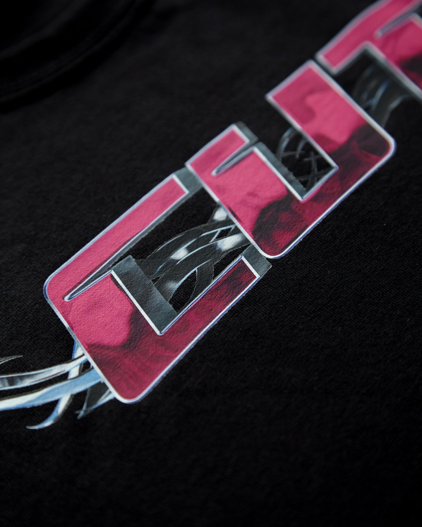 Chrome Y2K: CUT, pink and silver on black - sleeveless crop top.