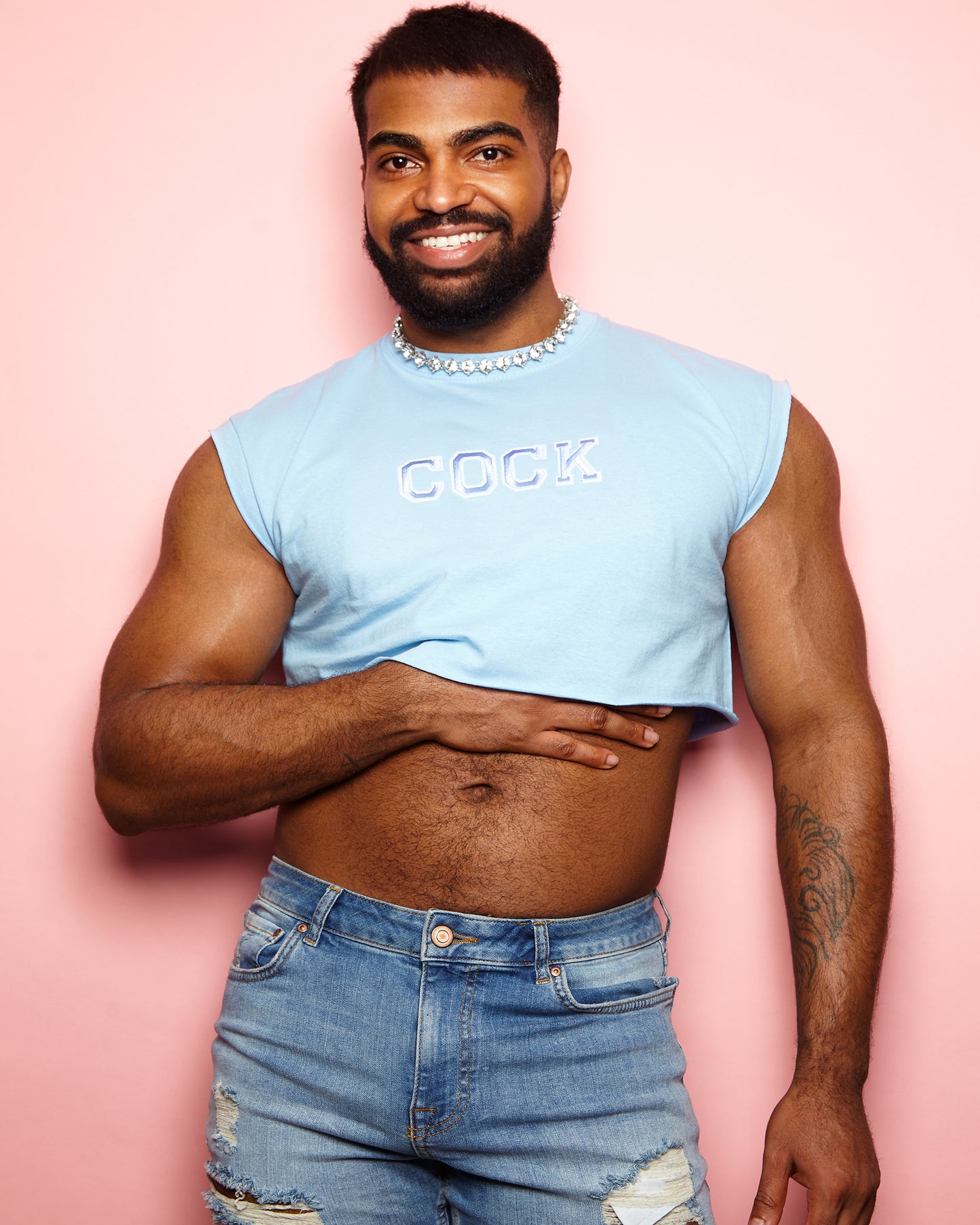 Varsity style cock embroidery on light blue - sleeveless crop top.